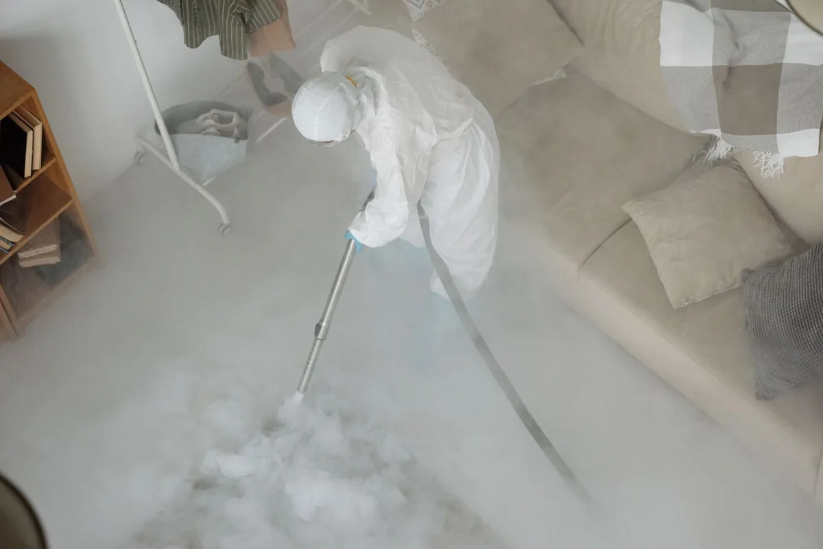 Biohazard cleanup technician in protective equipment, Polson, MT
